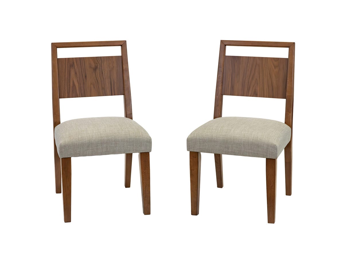 Two Cupertino dining chairs with walnut frames and beige upholstery